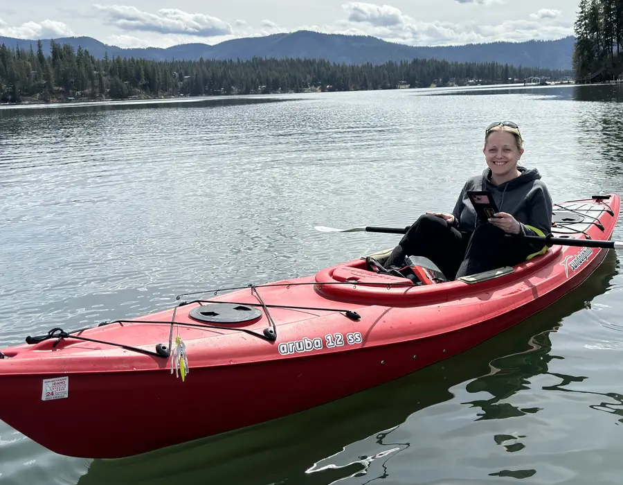 Jen Lenz biking through a North Idaho community