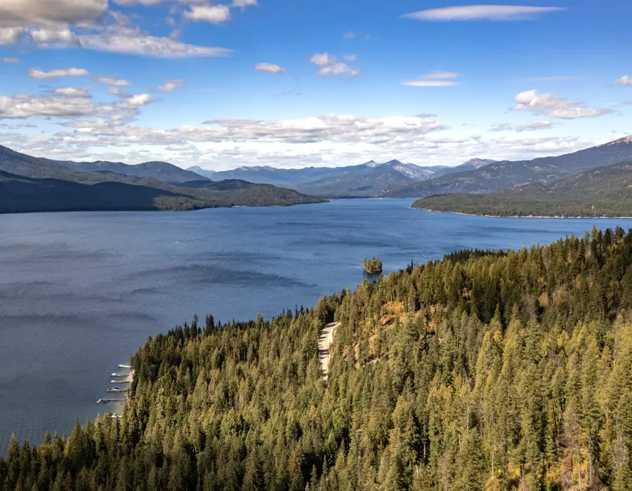 Priest Lake shoreline surrounded by dense forest